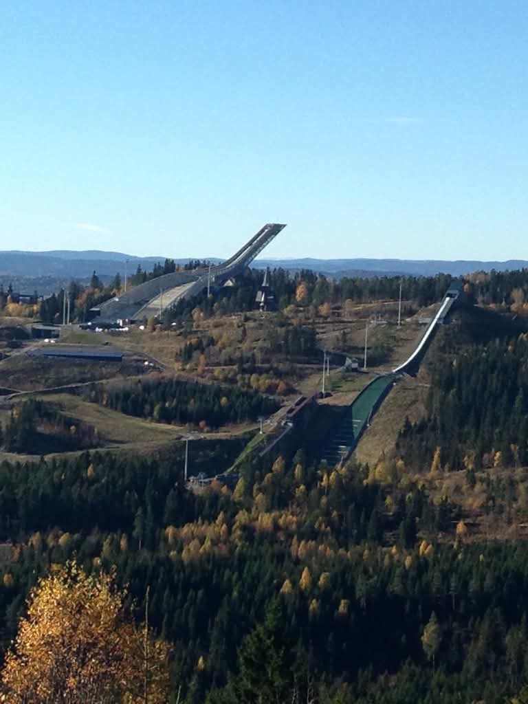Holmenkollen ski jump viewed from Vettakollen — Oslo's iconic landmark in autumn